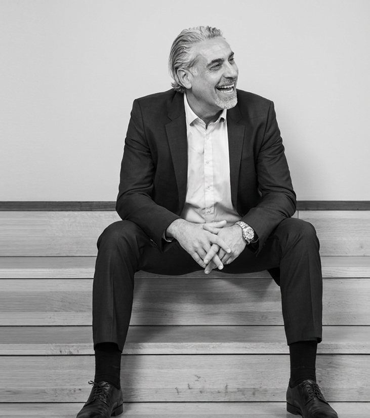Rainer Schmitt, Super Connector, seated on wooden steps
